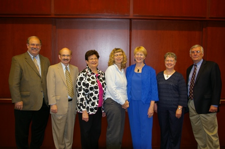 Pictured from left to right are Dr. Wade Clapp, M.D., Dr. John Rau, M.D., Dr. Judith Ganser, M.D., Lesa Paddack, Susan Pieples, Dr. Darlene Kardatzke, M.D., and Dr. George Jesien, Ph.D. (Director, AUCD)